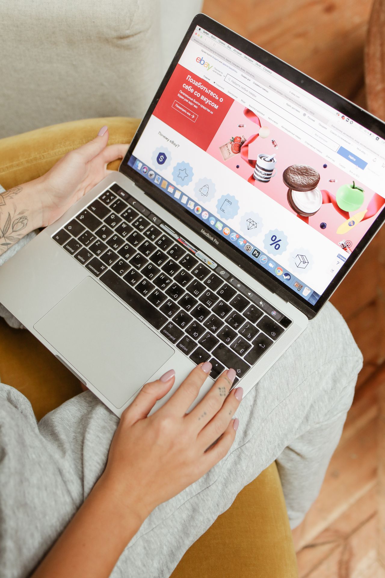Person browsing an online shopping website on a laptop, representing research into custom website design and cost
